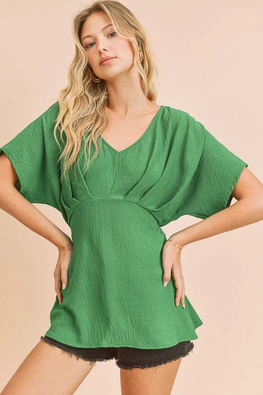 Kelly Green A V-Neck Dolman Short Sleeve Woven Blouse With Front Pleat Details